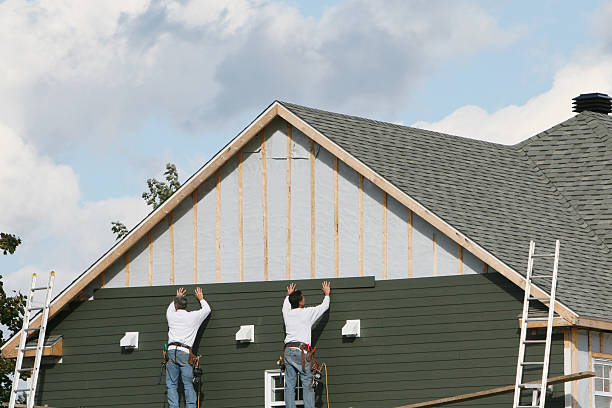 Professional Siding Contractor technician working in Ault, CO